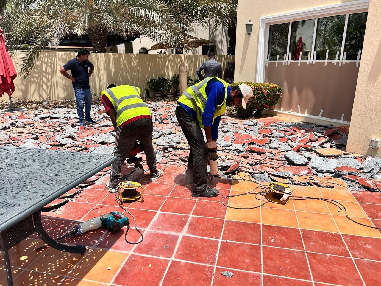 Vocus site team breaking out an existing terrace ahead of reconstruction, Dubai