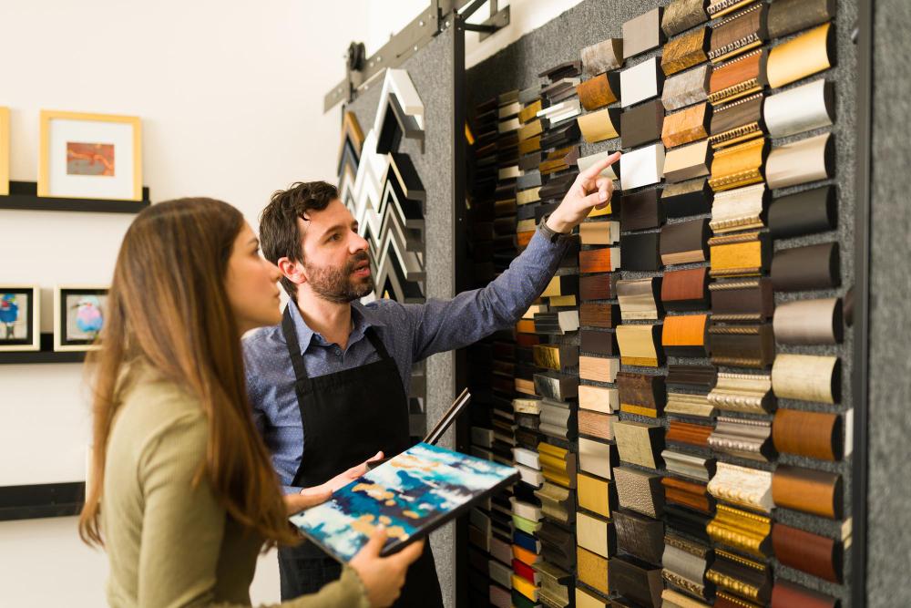 Client and specialist reviewing a wall of finish and moulding samples during fit-out material selection