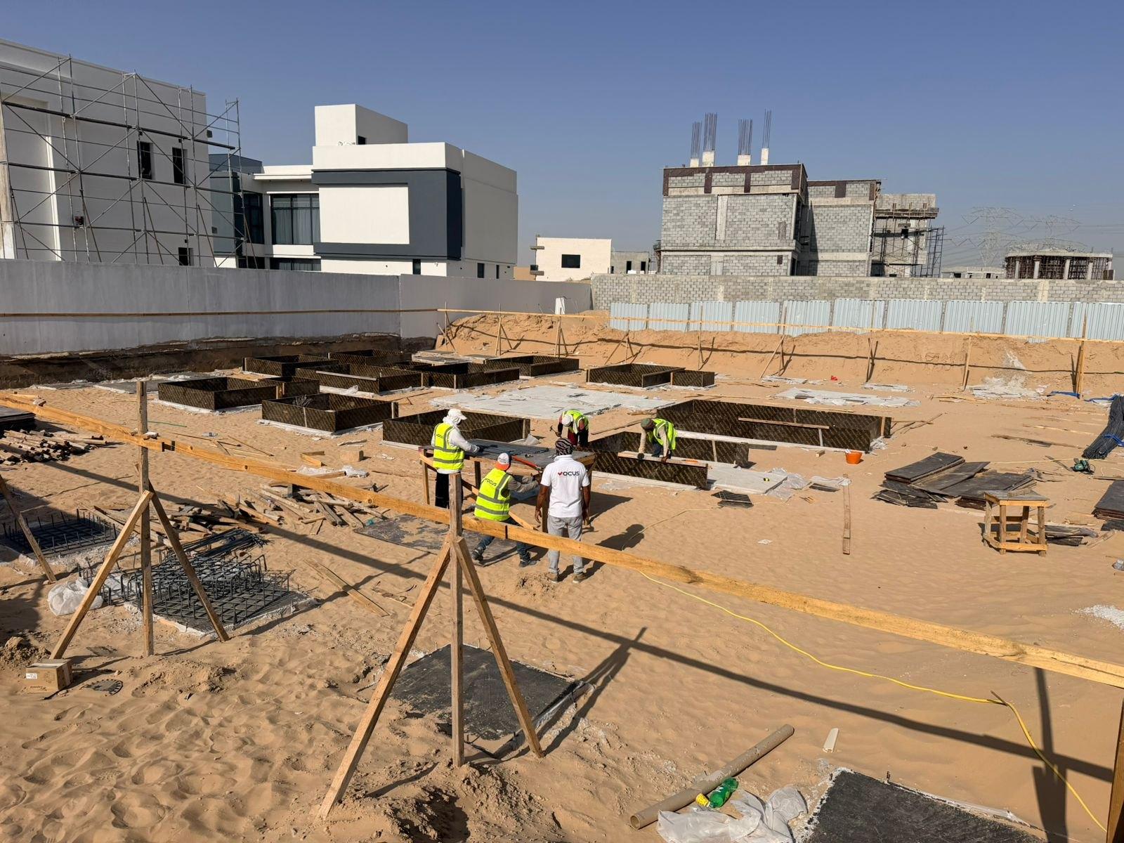 Excavated plot and substructure works viewed across the site, private villa, Al Aweer First, Dubai