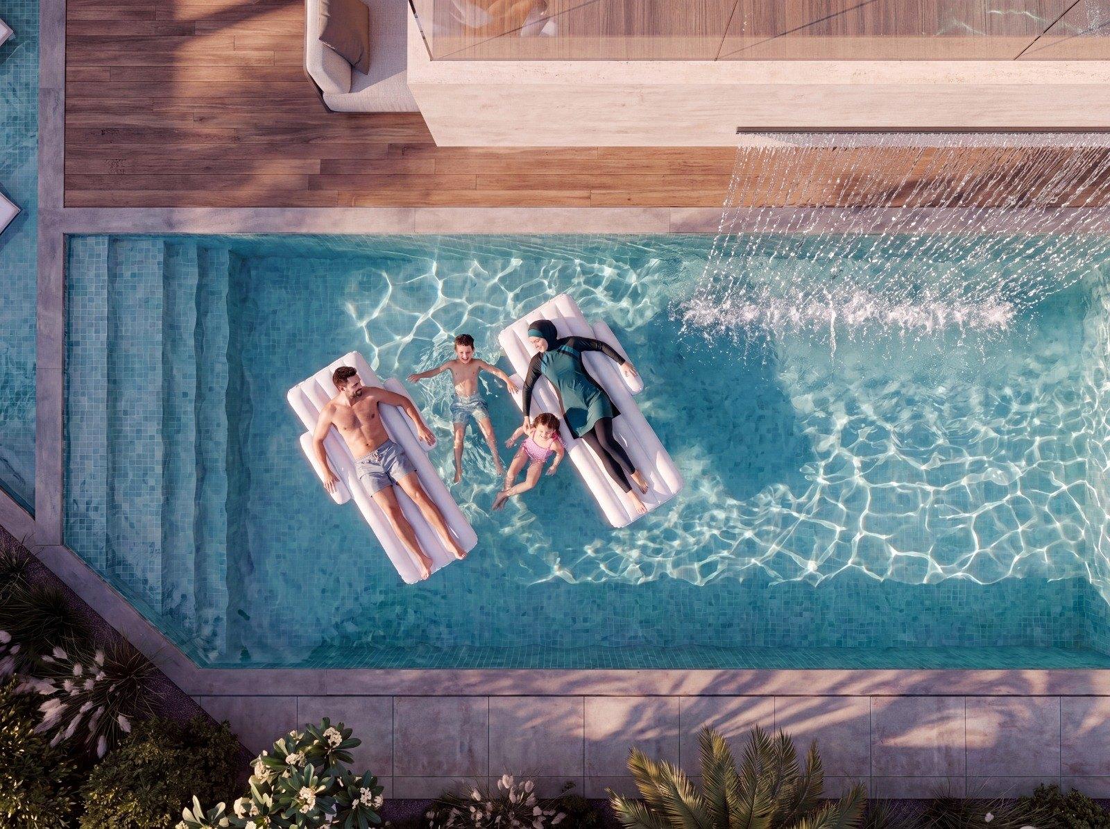 Contemporary Arabic villa concept, Dubai — aerial view of the pool and timber deck (view 11)