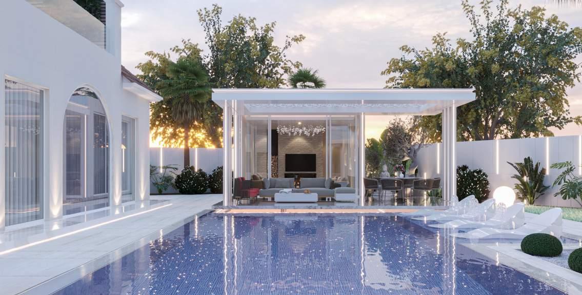 Villa pool and outdoor living at night, Dubai — by Vocus Design & Build